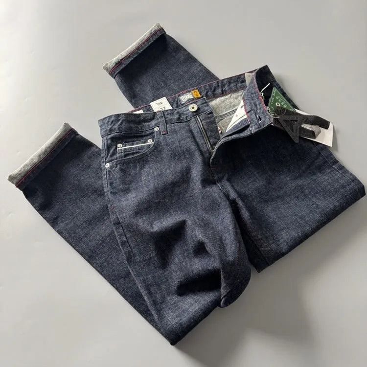 Men's straight leg cotton denim jeans in a primary colour, shown on a mid-waist fit model.