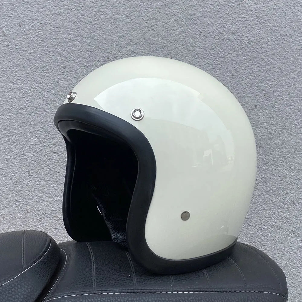 Retro-style half motorcycle helmet in fibreglass, shown in a cement grey colour option.