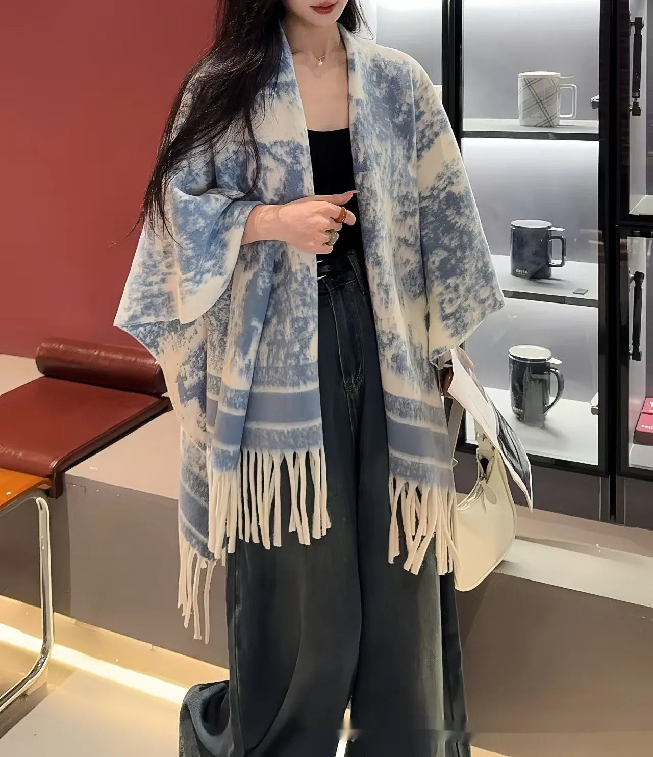 Women's polyester scarf cape in a free size with tassel detail, shown in one of five available colours.