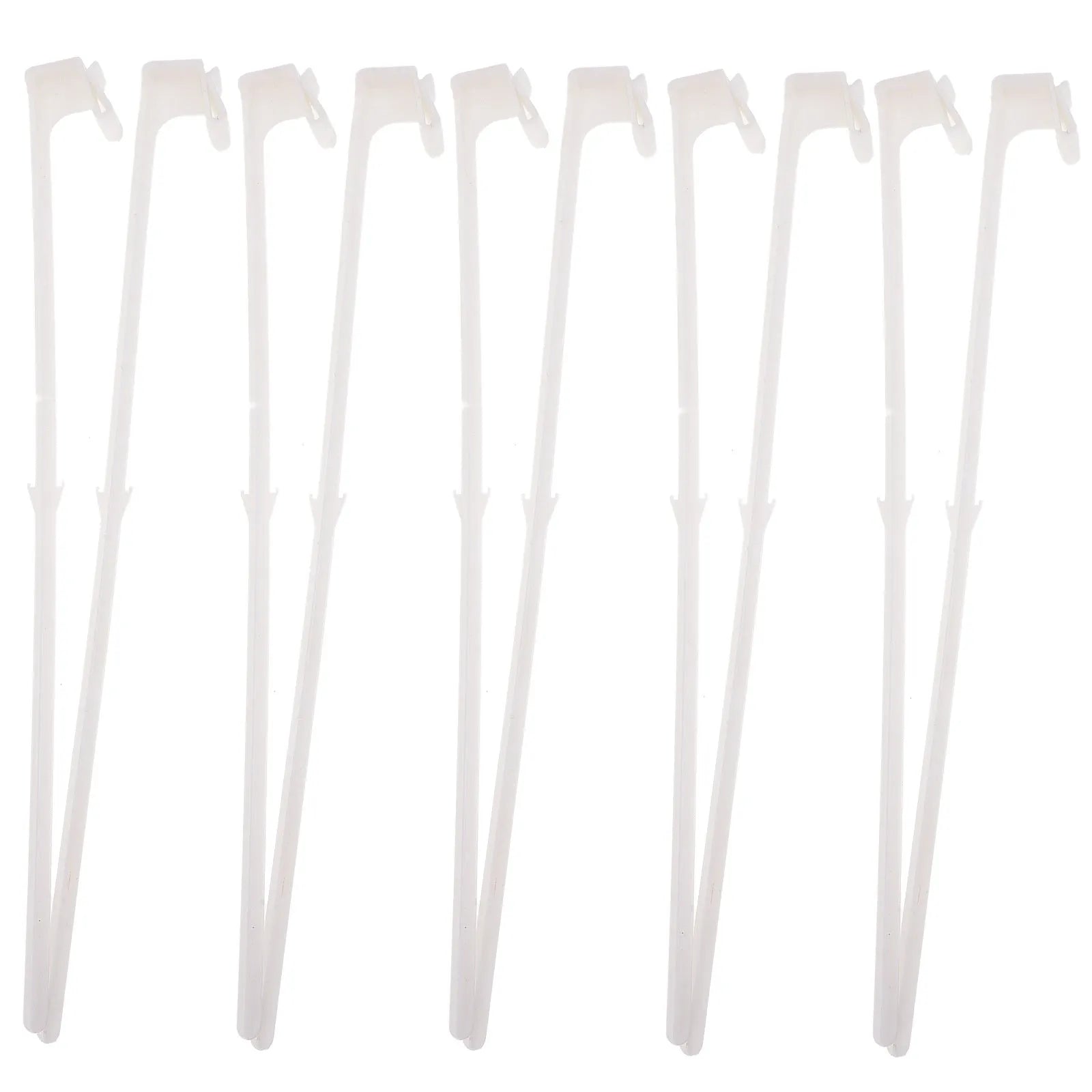 Ten white plastic car window flag pole holder clips laid out.