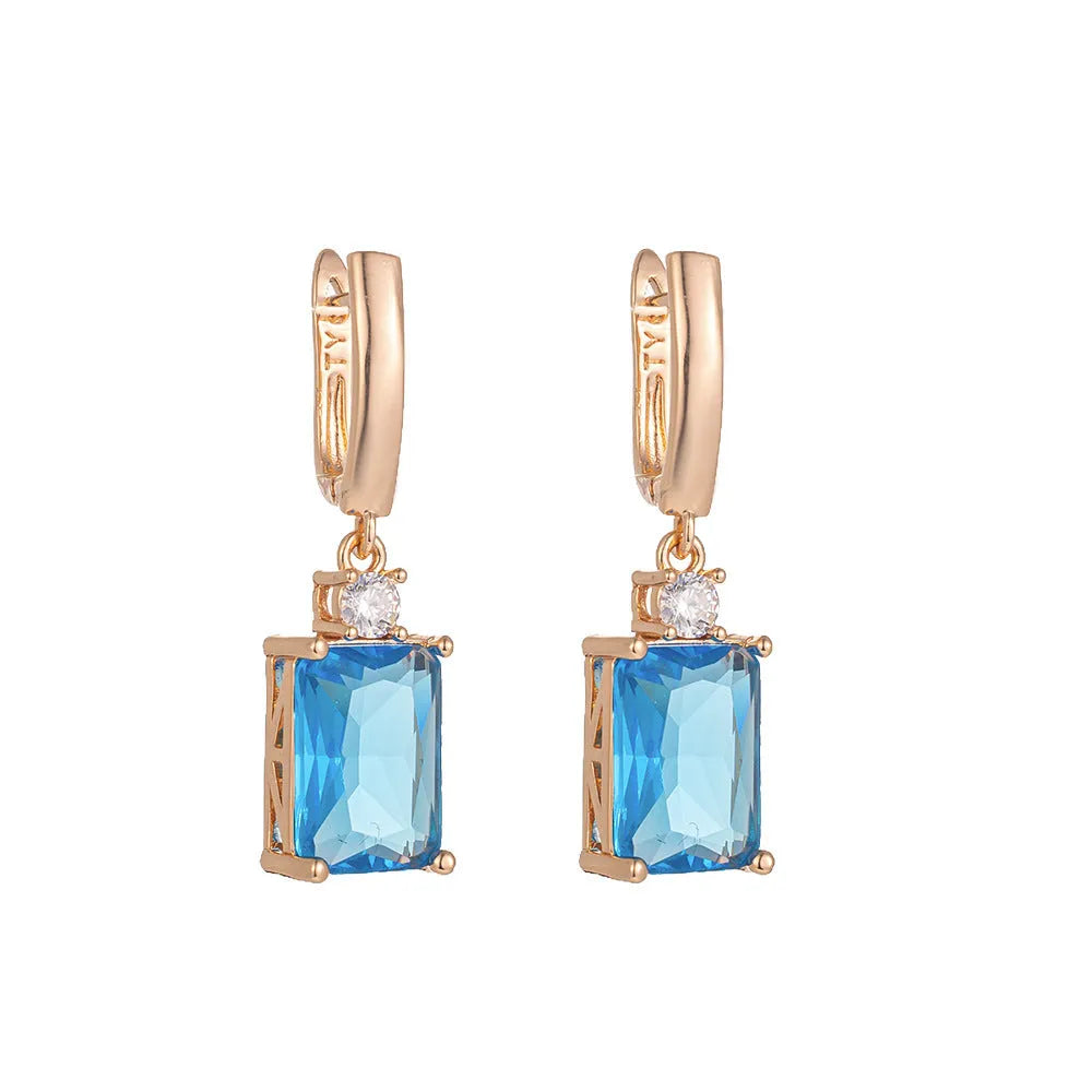 Square geometric earrings with electroplated gold or silver finish on copper, showing quadrilateral design elements