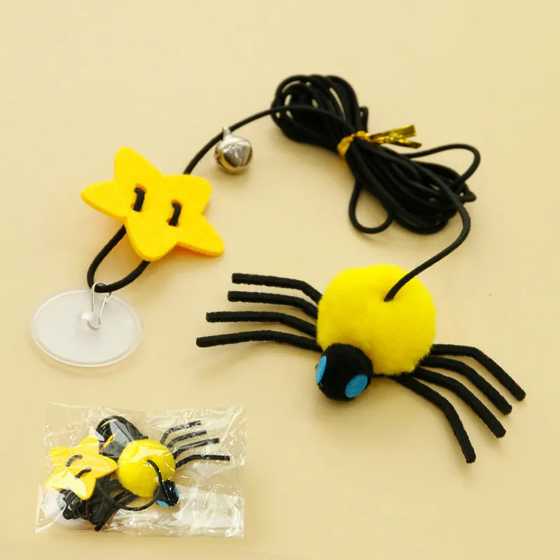 Cat hanging door toy with elastic rope, feather stick, bell, and spider decoration in red or yellow colours