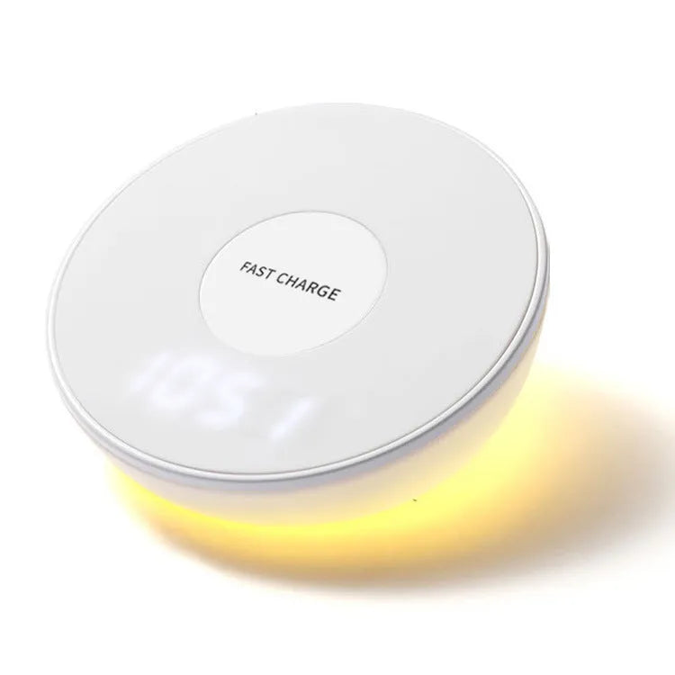 White wireless phone charger with digital clock display and three control buttons on the front.