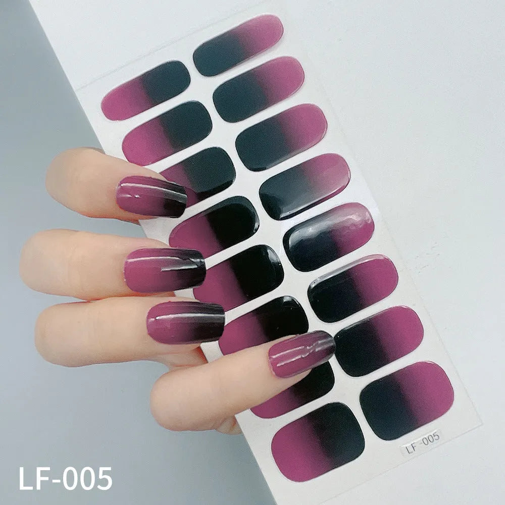 Full sheet of nail art stickers showing sixteen small designs including cross, rose, tulip, and leopard print patterns.