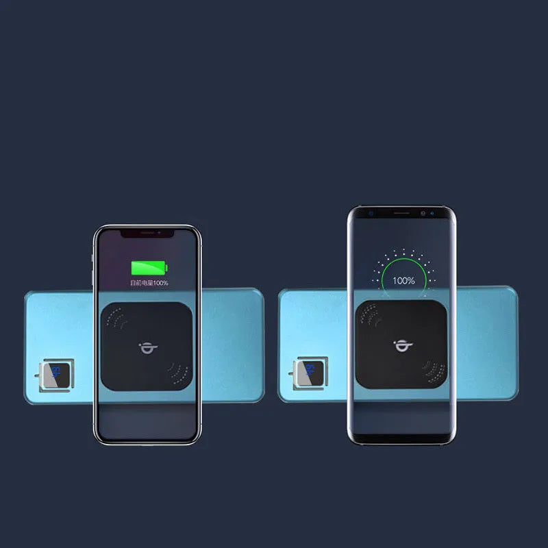 Silver coloured portable power bank with LCD display showing battery percentage, placed next to a mobile phone.