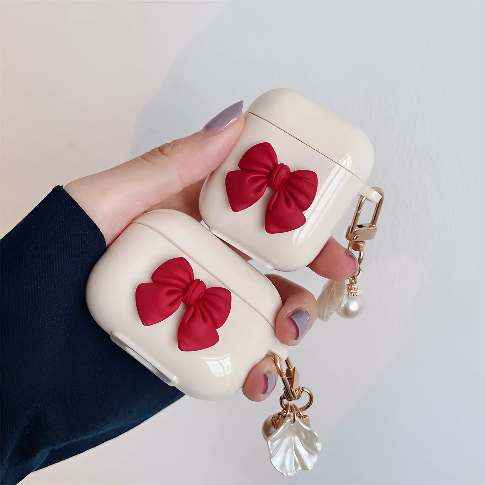Beige red bow shell TPU protective case cover for AirPods showing clamshell design