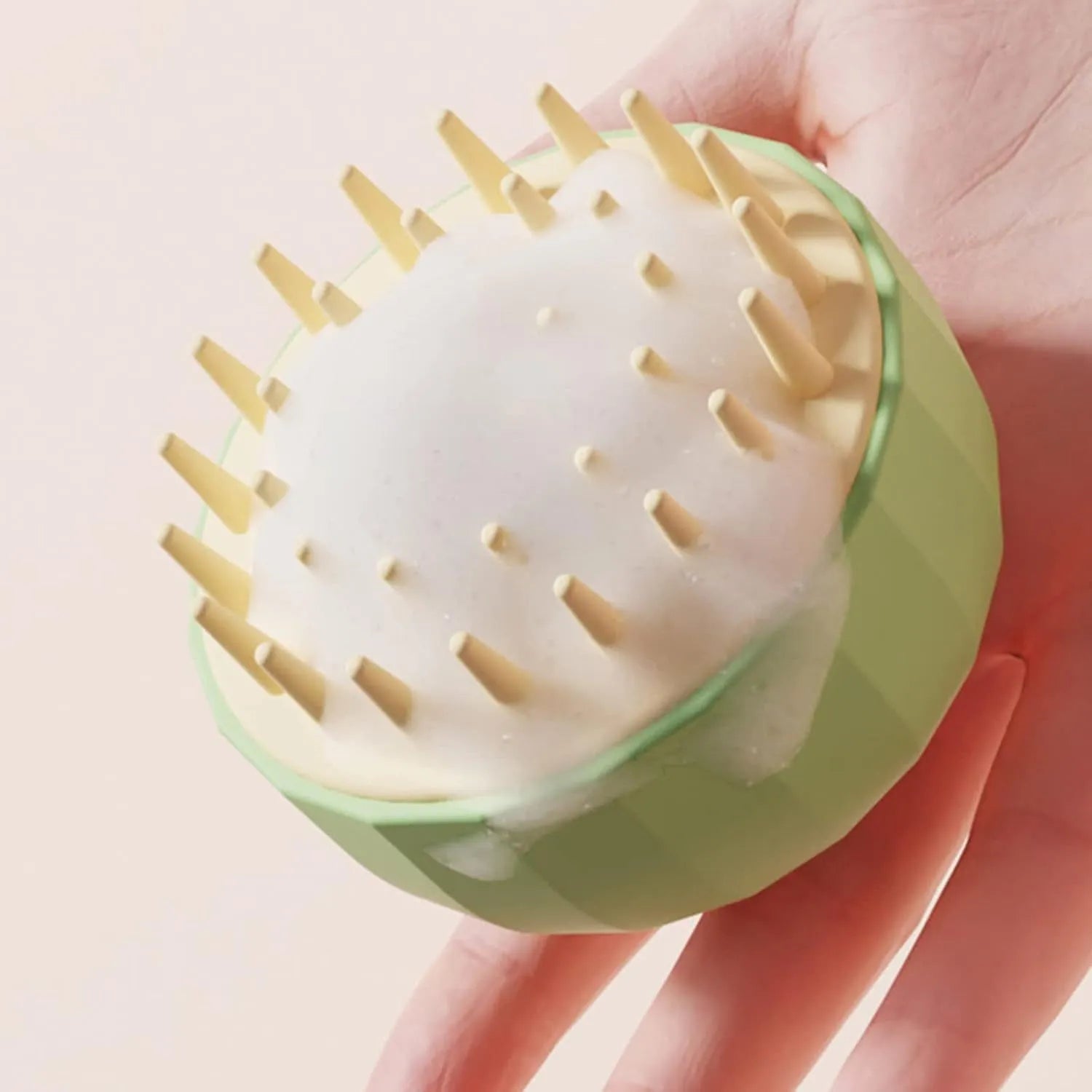 Green pet bath massage brush with dual-sided head and drain holes for dog and cat grooming
