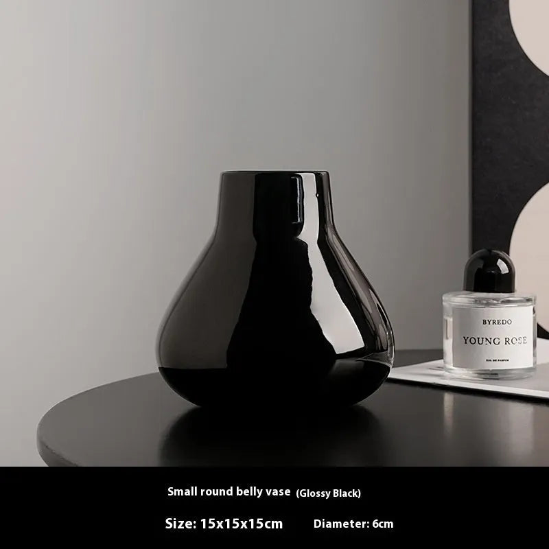 Ceramic decorative vase with artificial flowers in black or white modern design