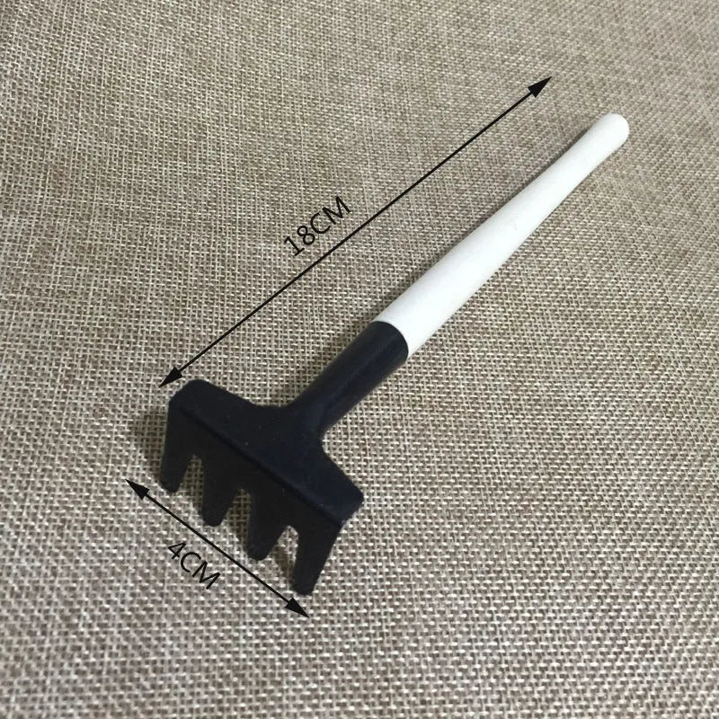 Succulent gardening tool set showing mini shovels, tweezers, watering can, brush and rake for small plant care
