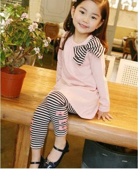Pink cotton girl clothing set with top and trousers in children's sizes