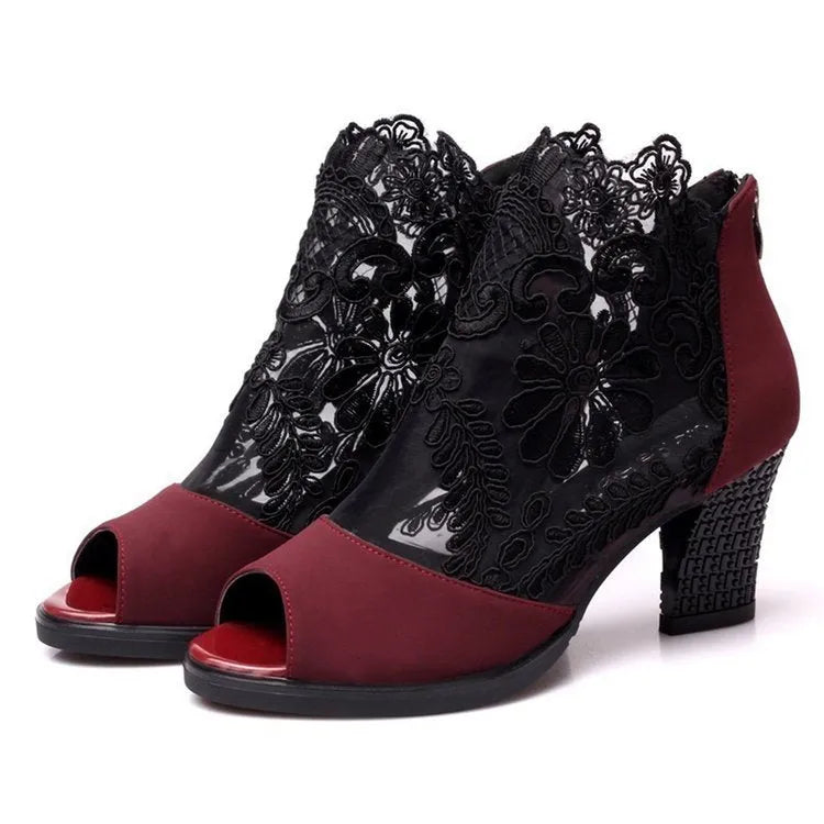Women's black lace gladiator sandals with square heel, floral pattern, and peep toe design