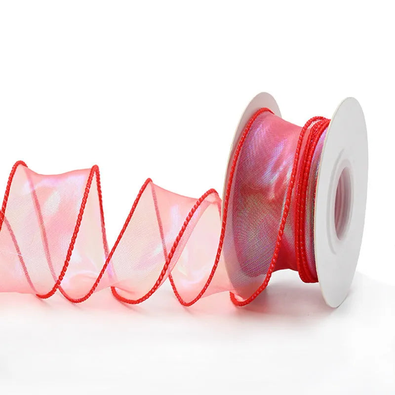 Fishtail yarn ribbon mesh with colourful wave pattern measuring 4cm wide for gift wrapping and decoration