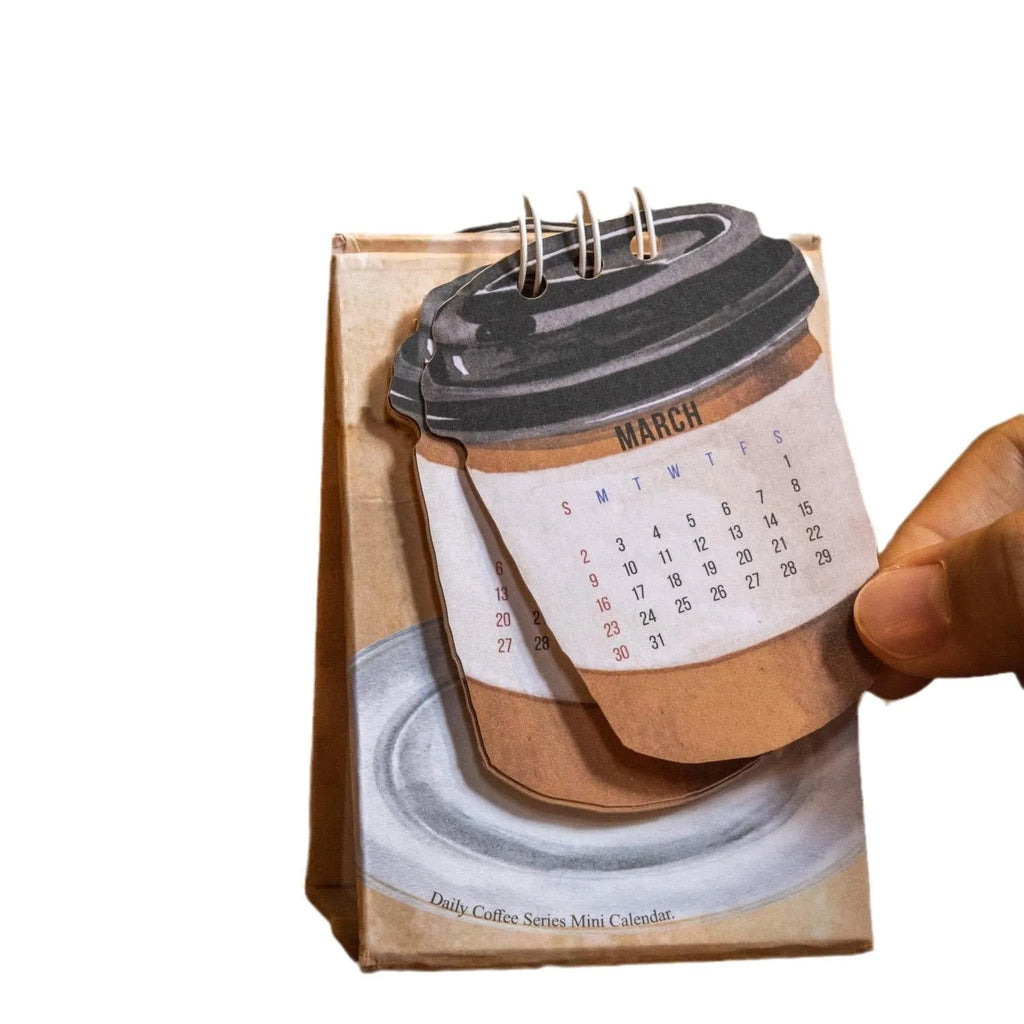 Mini 2025 desk calendar showing four design options including coffee time and motivational phrases