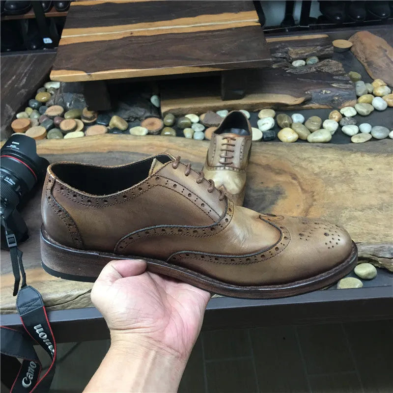 Men's light brown vintage leather casual shoes with carved distressed detailing and lace-up closure