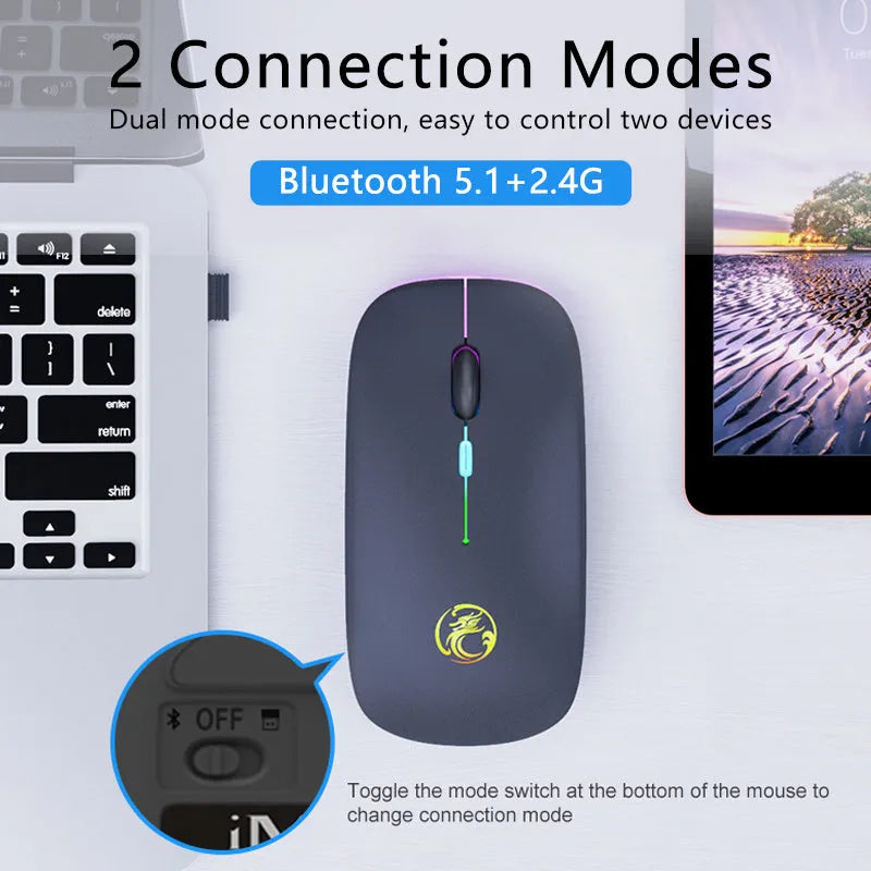 Black and white wireless mouse with silent buttons and luminous charging scroll wheel on a desk.