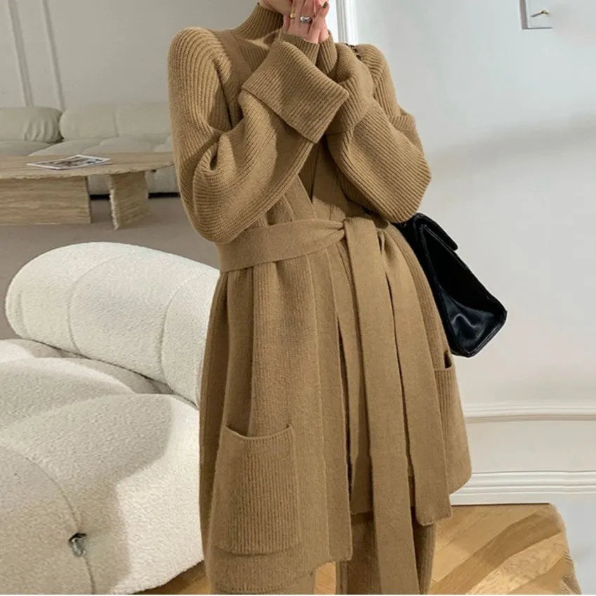 Women's apricot knitted three-piece set with cardigan, sweater and wide-leg trousers featuring leather stitching.