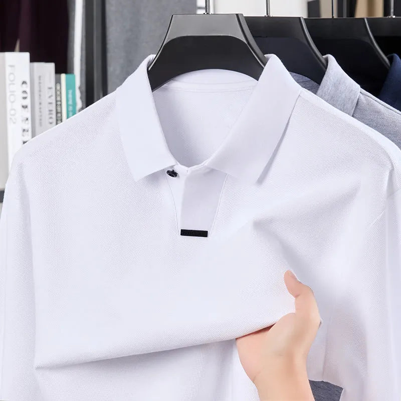 Men's loose-fit cotton polo shirt with lapel collar in grey, shown on a model.