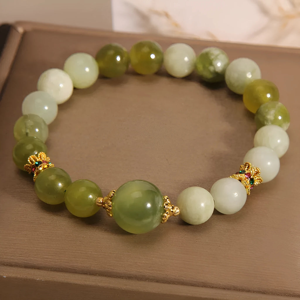 Women's bracelet made of green Xiuyan jade in an original sweet Mori style design.