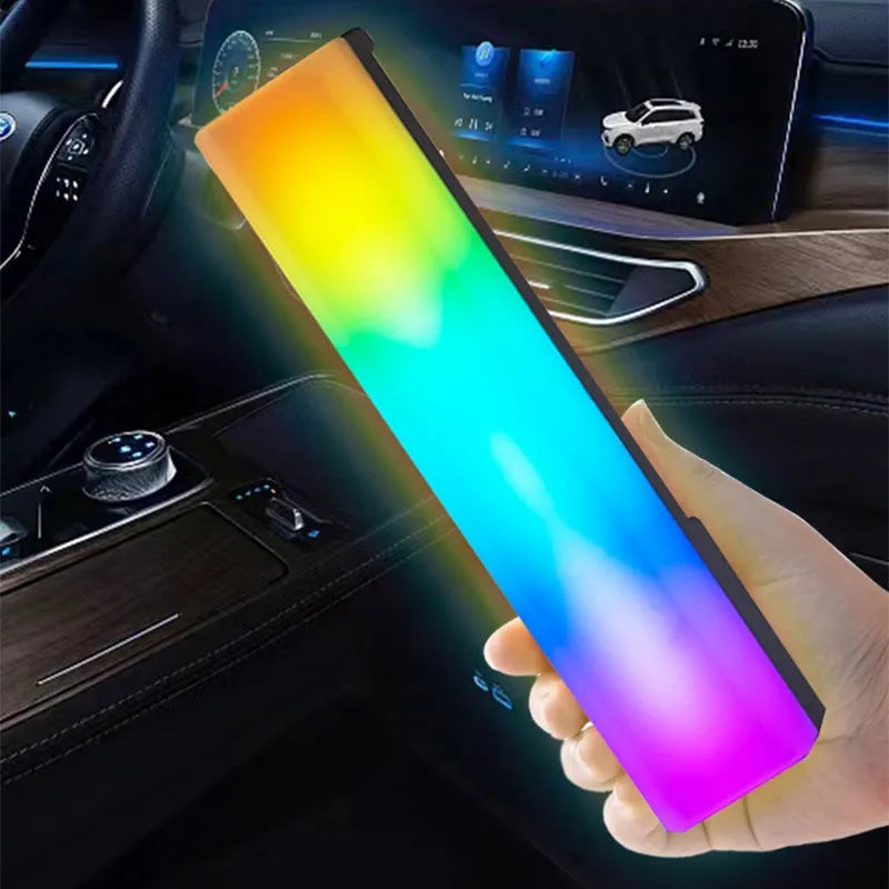 Tall 3D RGB LED ambience lamp with colourful lights on a desk, showcasing its voice-activated music rhythm mode.