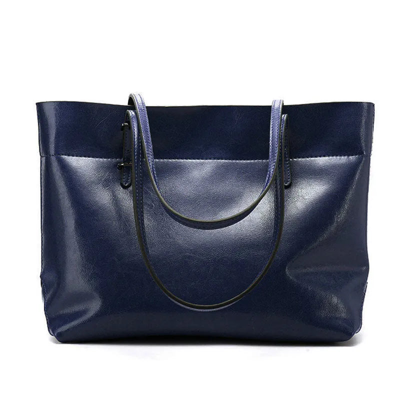 Brown waxed cowhide leather cross-body handbag showing two main compartments and a front mobile phone pocket.