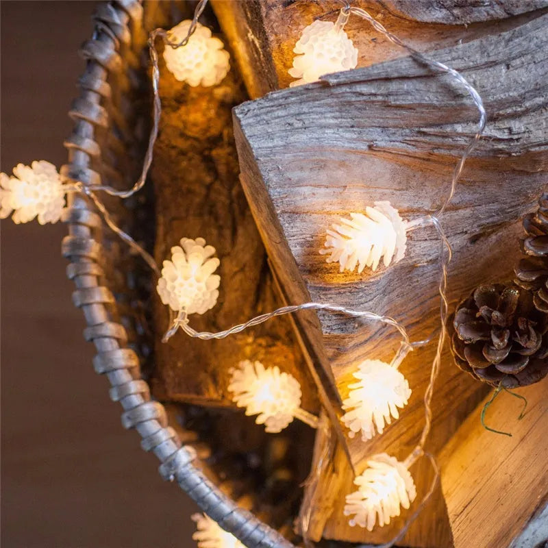 LED pine cone light string with plastic shell housing in warm white colour