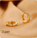 Geometric interwoven hemp rope earclip earrings for women in gold and silver colour options.