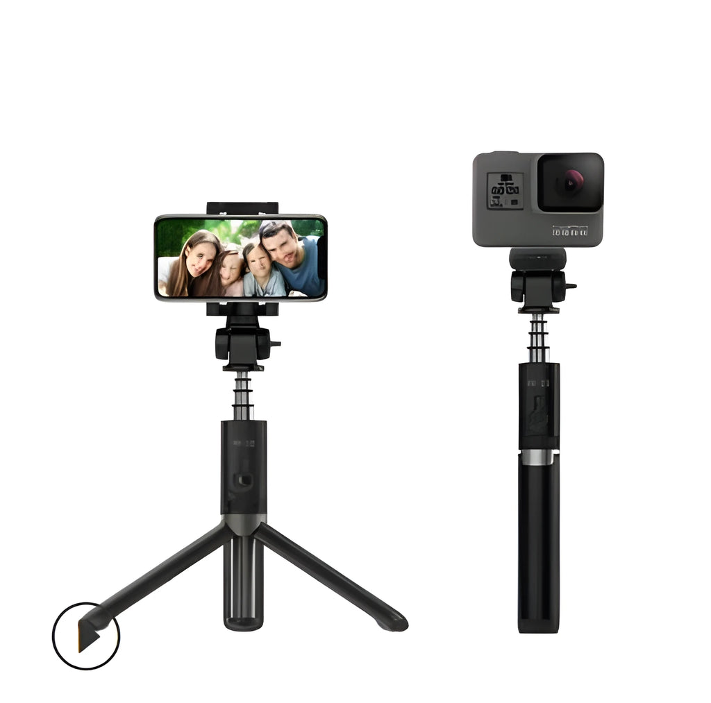 Aluminium Bluetooth selfie stick with tripod legs extended and wireless remote on a table