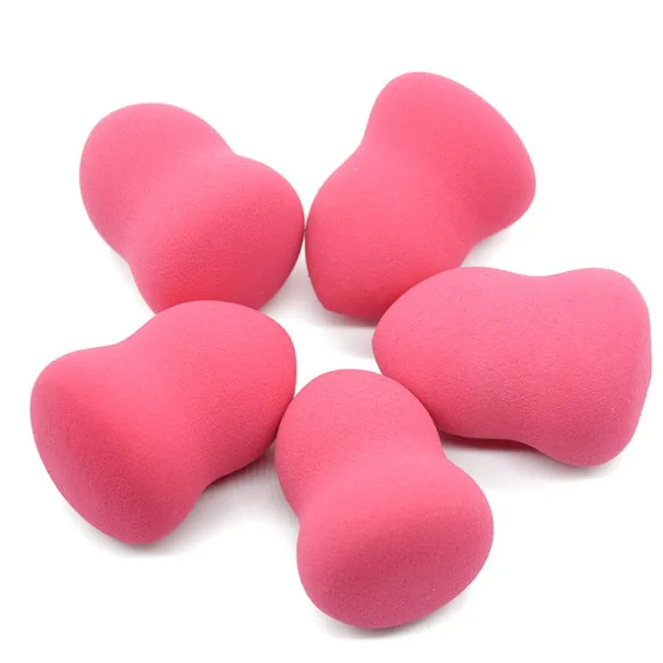 Pink hydrophilic non-latex makeup sponge puff on a white background