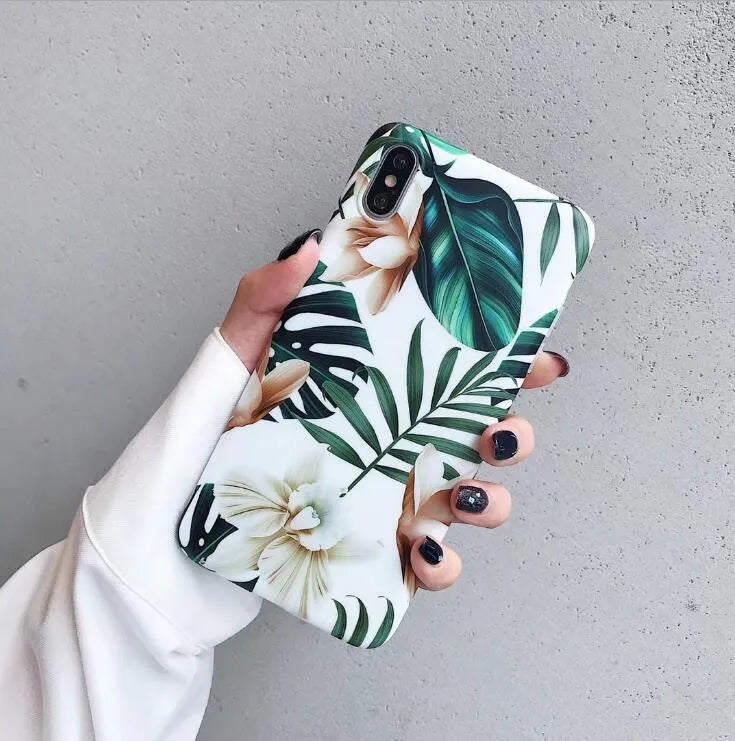 Soft TPU iPhone case with printed floral banana leaf design on the back.