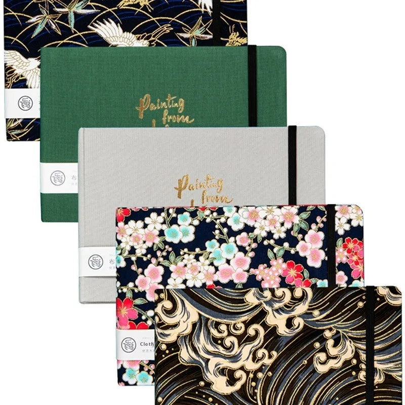 Feiluniao handmade fabric watercolour notebook in 185mm portable size, showing artistic cover design.