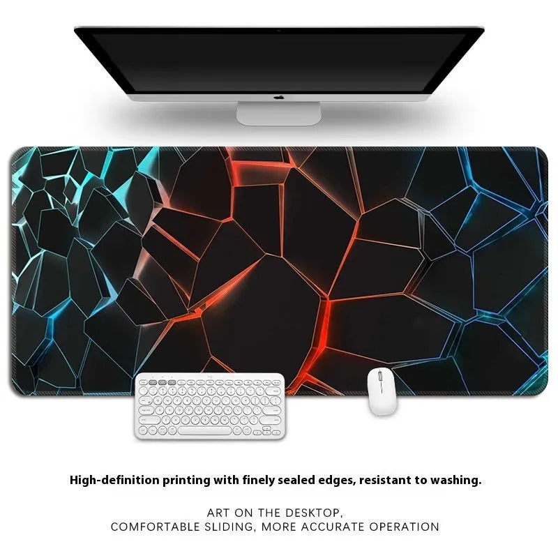Natural rubber computer desk mat with printed pattern and overlock edge, shown on a wooden desk.