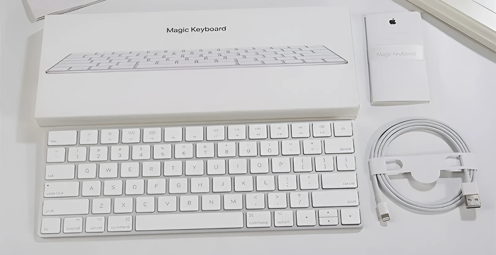 Apple white Bluetooth wireless keyboard with metal construction and multimedia keys