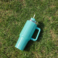 Large stainless steel vacuum insulation cup with double-layer construction in rainbow gradient colours