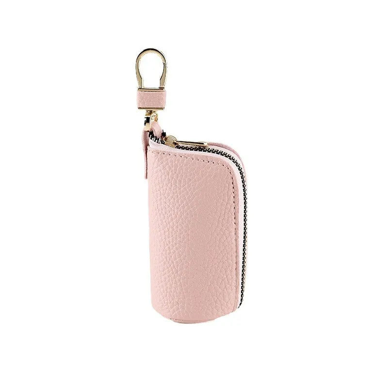 Minimalist black waterproof PU leather zip key pouch for car keys on table