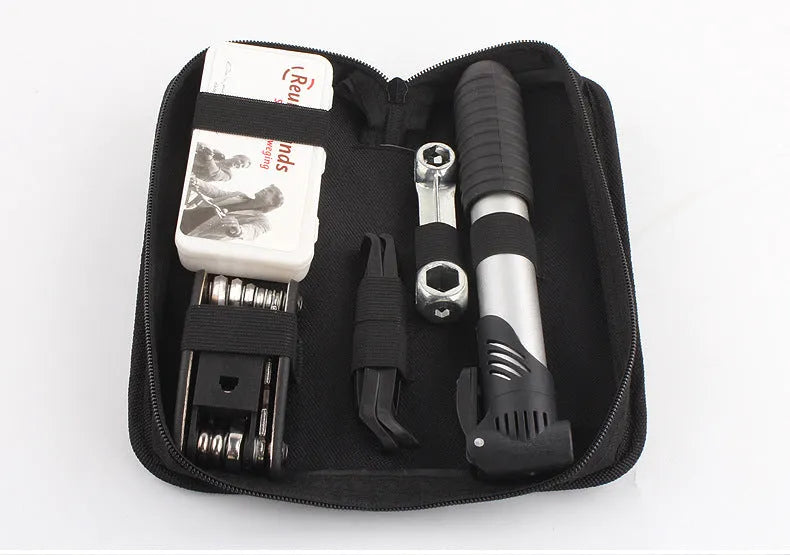 Black tool kit case containing 81-piece bicycle repair set with sockets, wrenches and mini pump