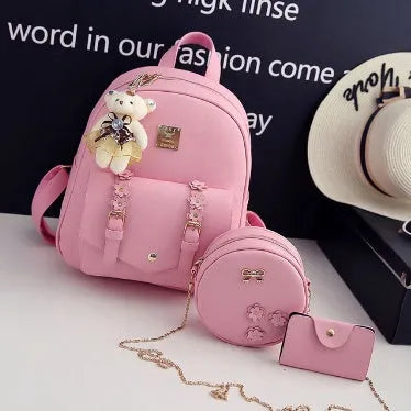 Women's three-piece leather backpack set showing backpack, shoulder bag and card holder in coordinated colours