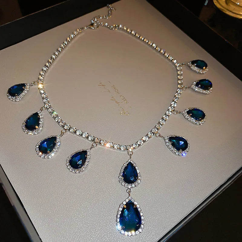 Silver needle water drop earrings and necklace set in blue and silver blue with alloy and zircon pendant