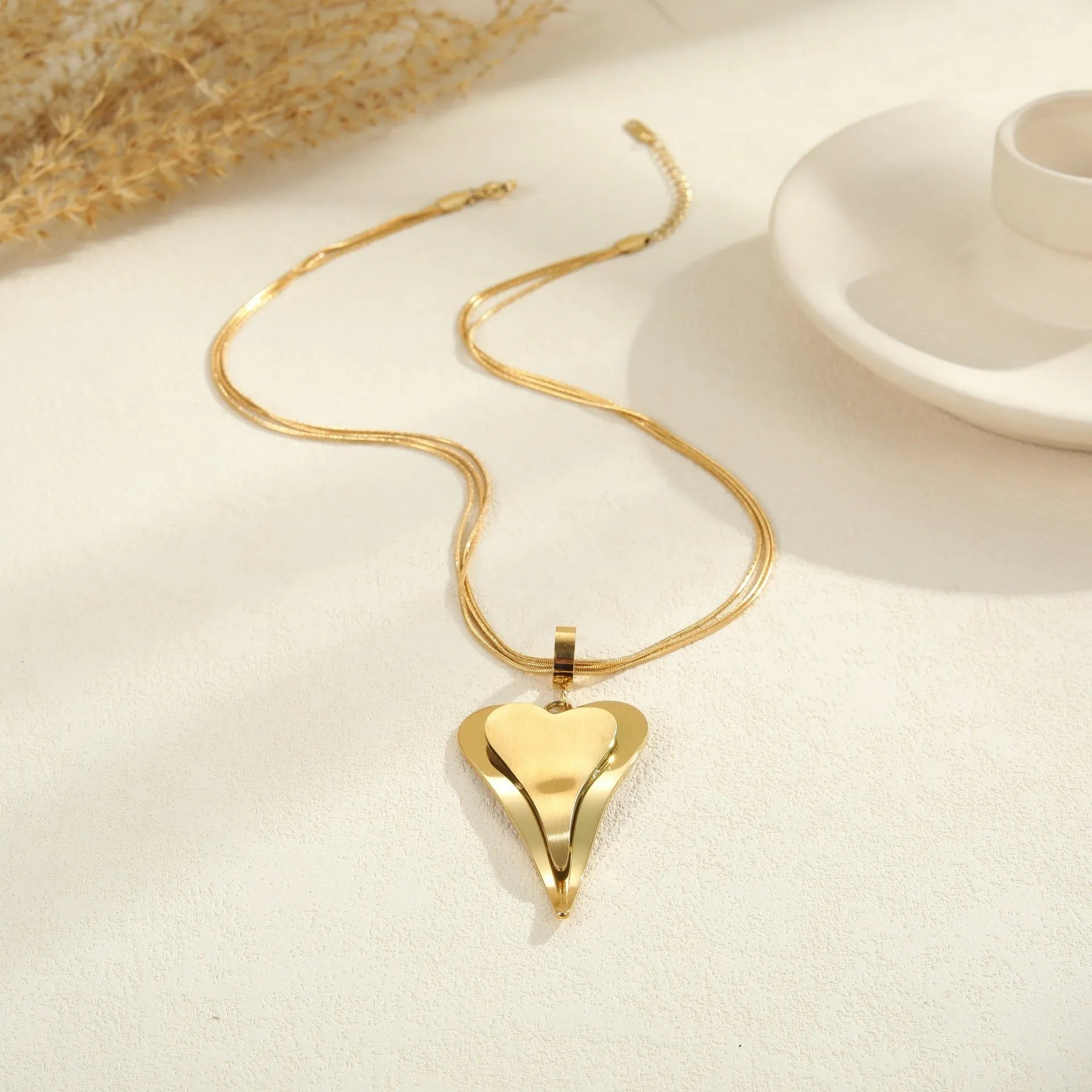 Geometric double heart pendant necklace with snake bones chain in stainless steel, gold tone and steel colour options