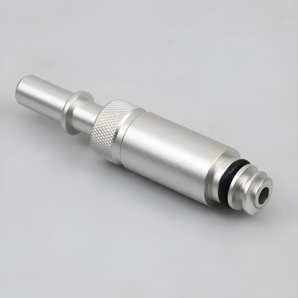Silver metal transmission refuelling joint for VAS6262-9 tool on a workshop bench.