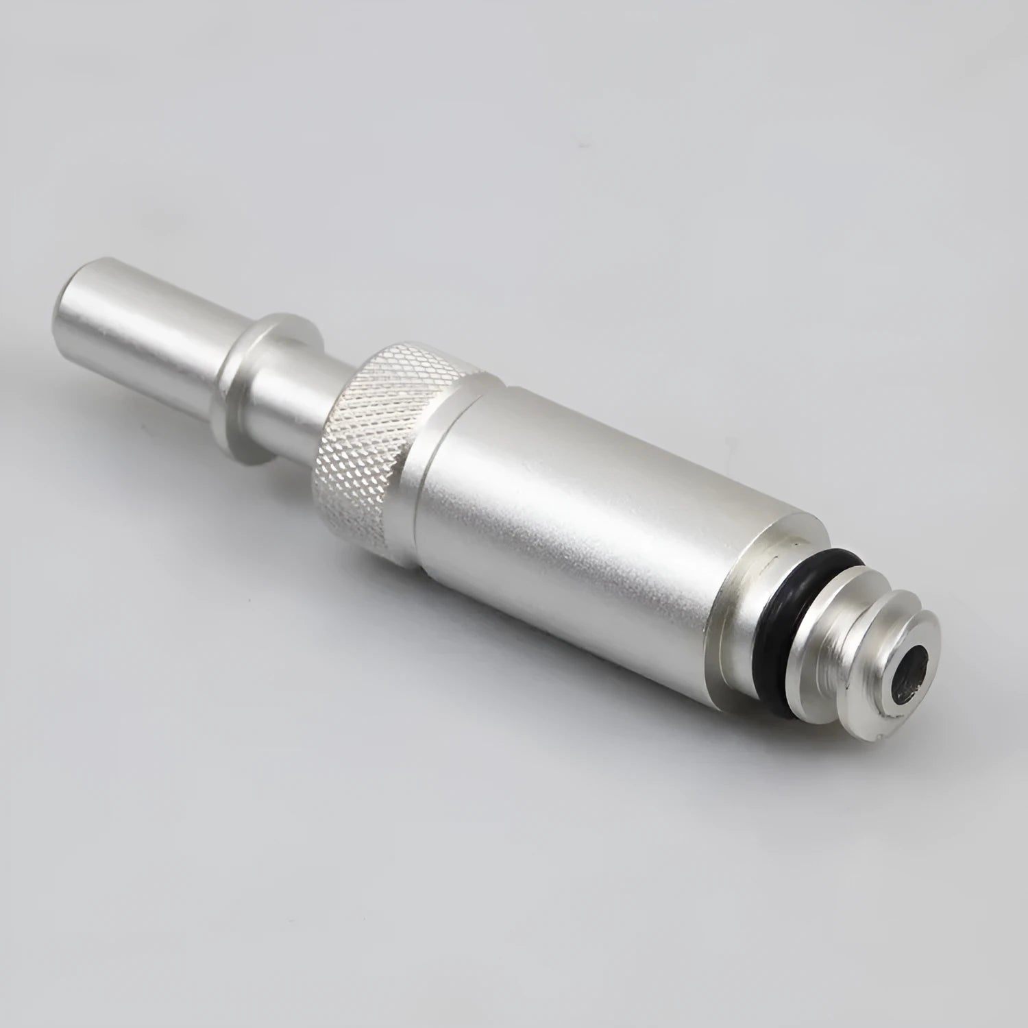 Silver metal transmission refuelling joint for VAS6262-9 tool on a workshop bench.