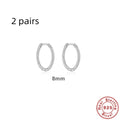 Sterling silver twisted ring earrings in geometric round design with gold or white gold finish