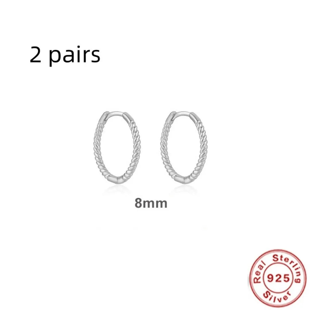 Sterling silver twisted ring earrings in geometric round design with gold or white gold finish