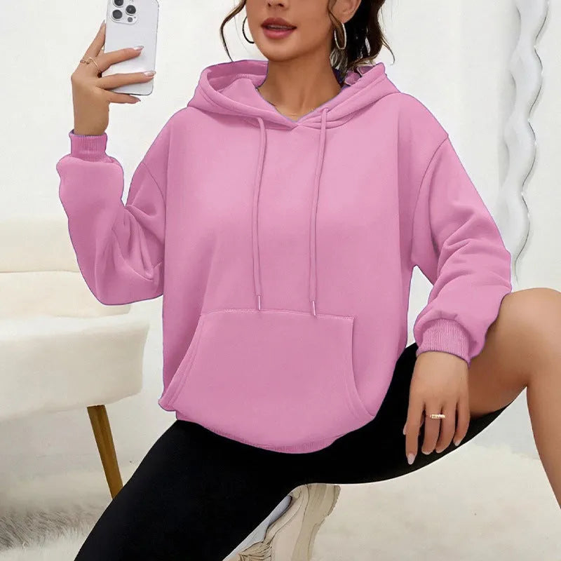 Women's loose drawstring pocket sweatshirt in various colours showing front pockets and adjustable collar