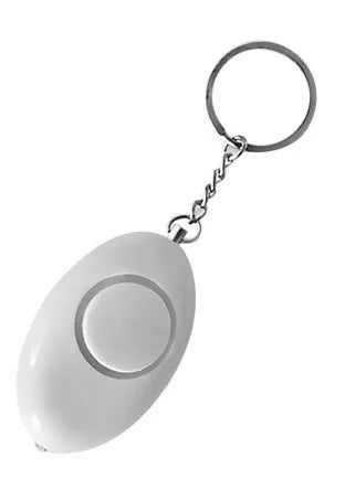 Egg-shaped personal safety alarm keychain in pink with metal pin on a white background