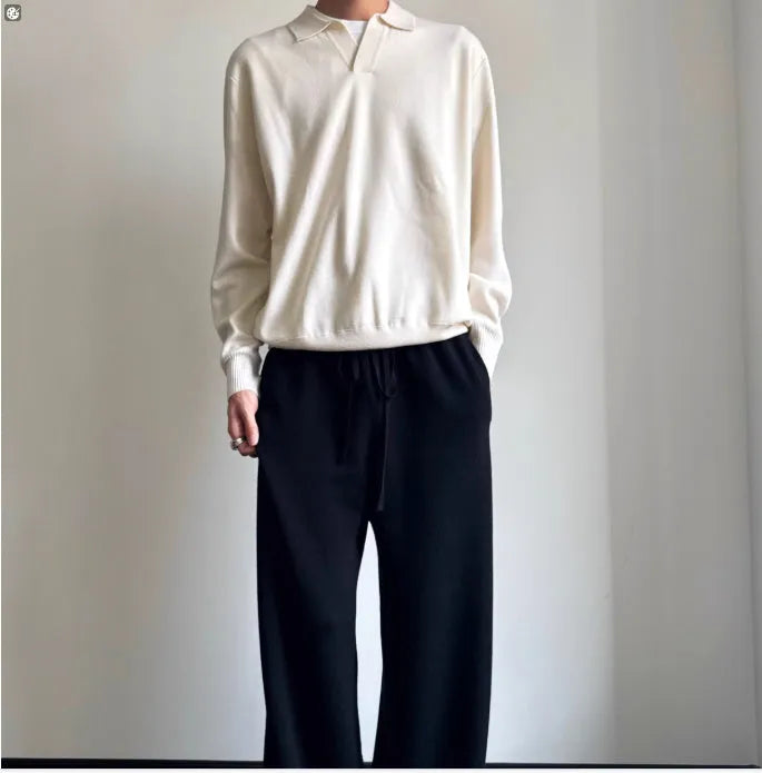 Pure wool polo sweater with a lapel collar in loose fit, shown in Navy Blue.