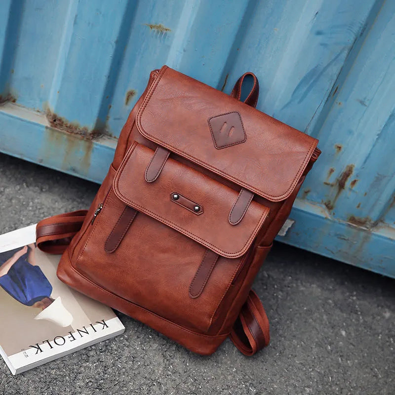 Gray leather retro laptop backpack for men with compact 30cm by 20cm by 10cm dimensions