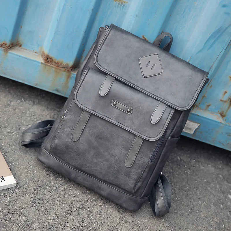 Gray leather retro laptop backpack for men with compact 30cm by 20cm by 10cm dimensions