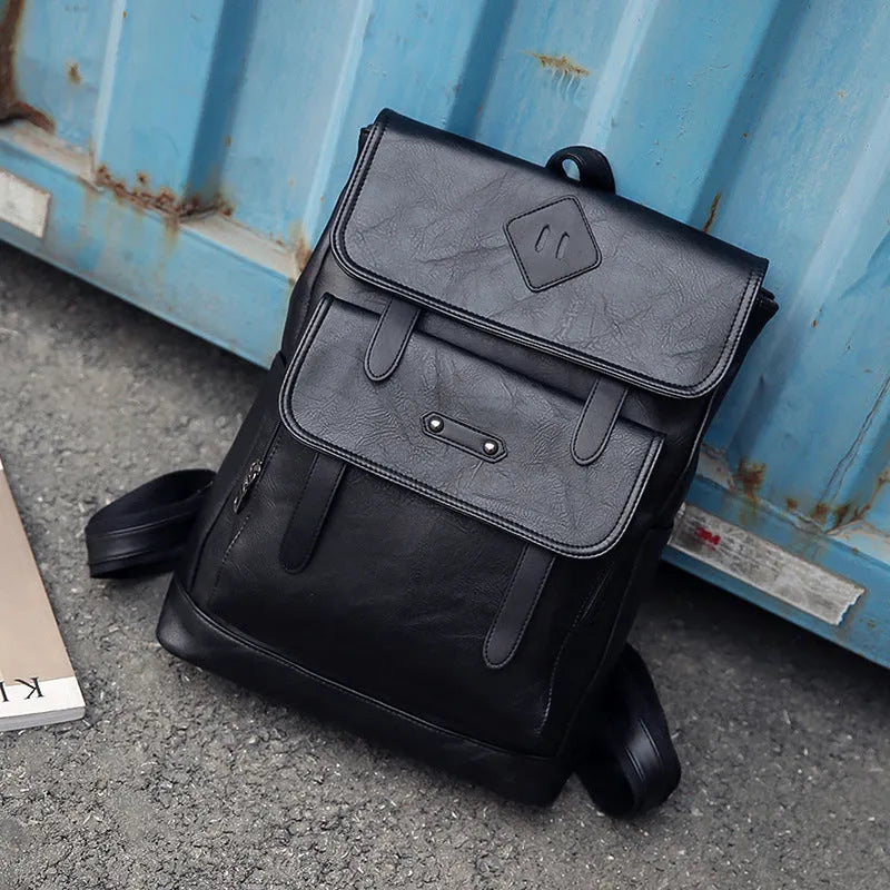 Gray leather retro laptop backpack for men with compact 30cm by 20cm by 10cm dimensions