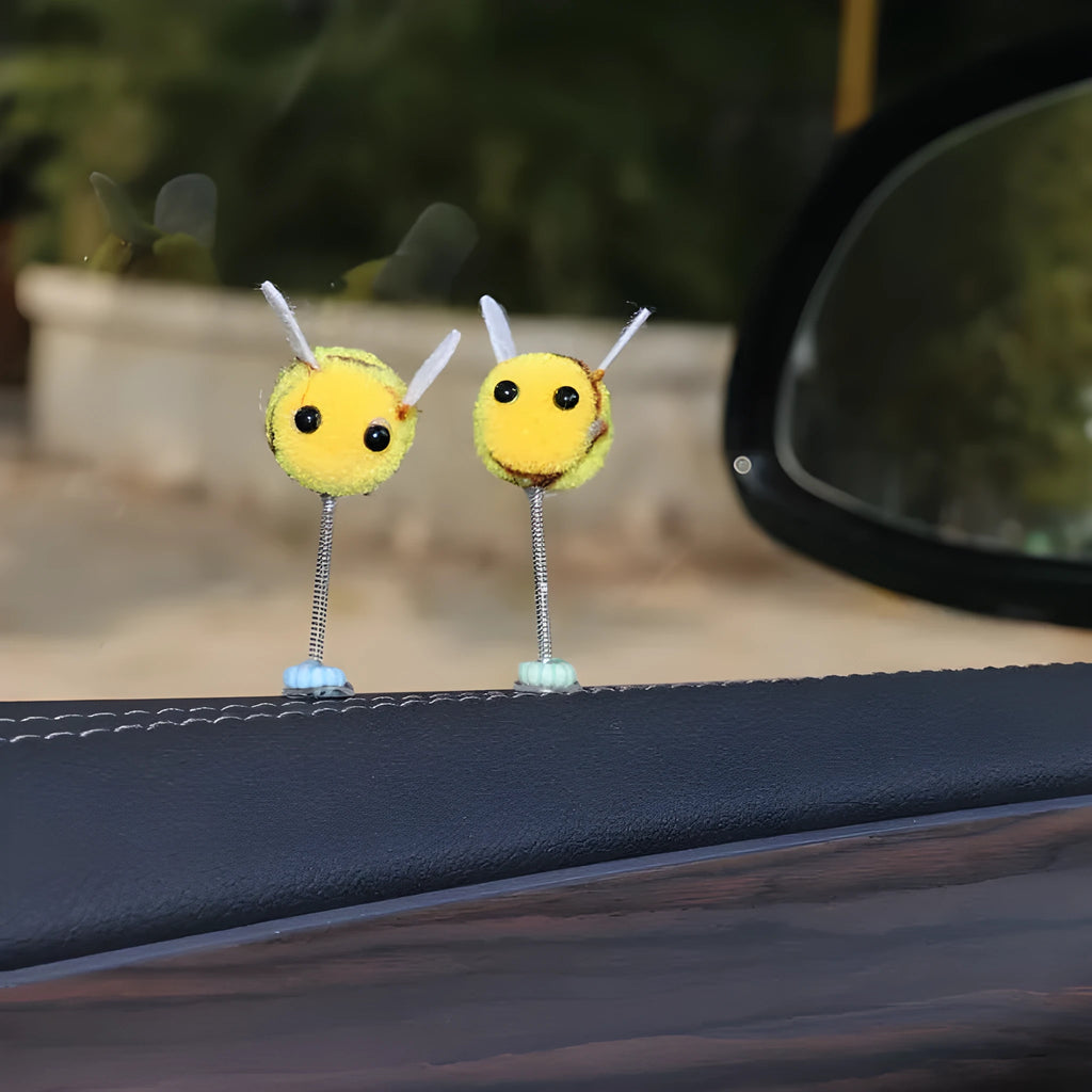 Yellow and black cartoon bee car decoration made from fur ball material measuring 3x3cm
