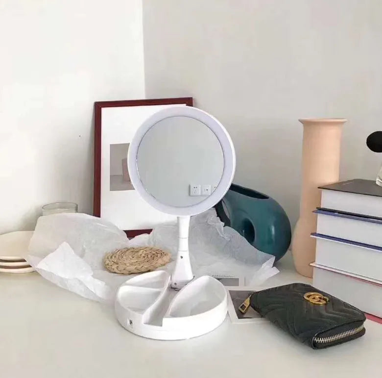 White foldable acrylic vanity mirror with LED lights and double-sided storage compartments